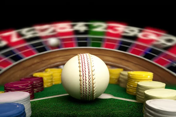 Un joueur utilise son smartphone lors d'un événement festif local, représentant le casino KWANZA entièrement adapté au mobile.